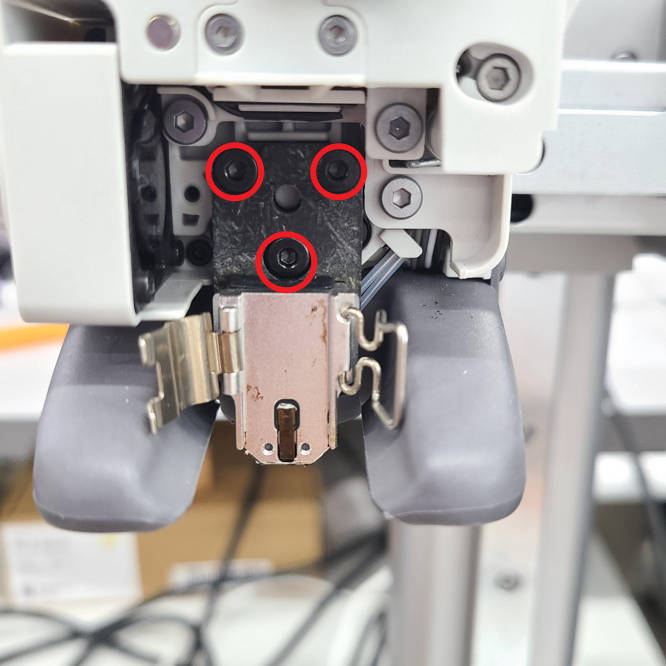 Front of the Bambu Lab A1 printer with hotend removed, showing three screw holes