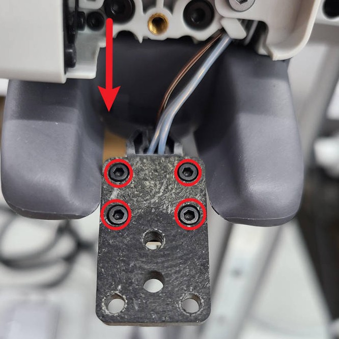 Front of the Bambu Lab A1 printer with panel removed, revealing four screws behind the hotend